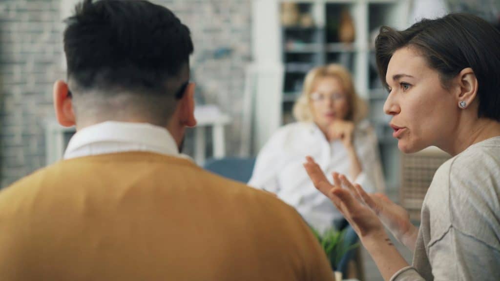 woman speaking calmly during discussion