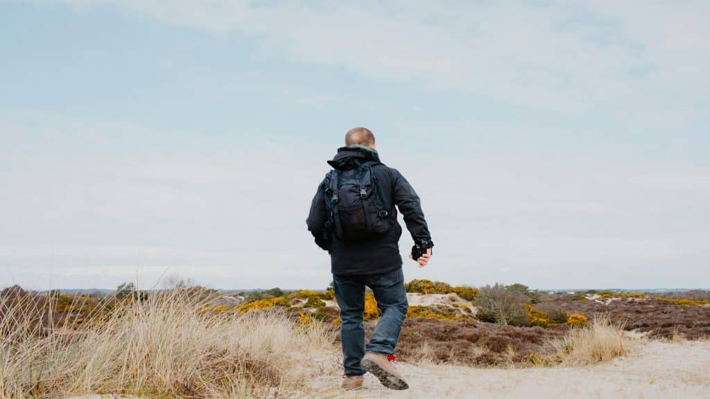 man walking alone outdoors