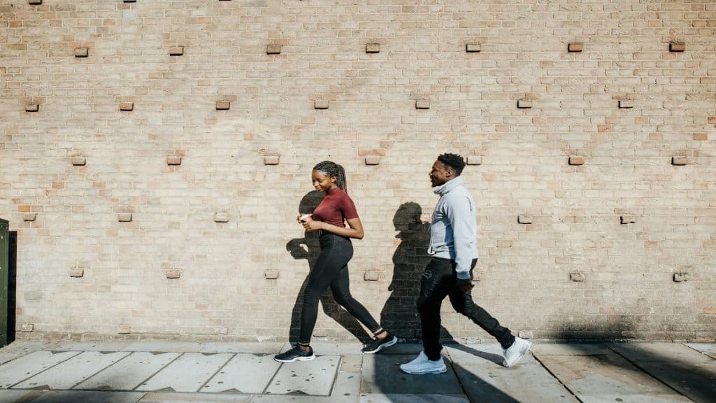 couple walking with space between them