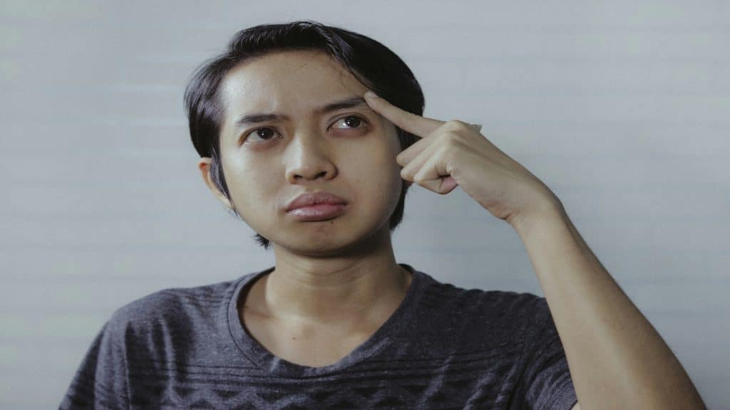 person looking confused while thinking