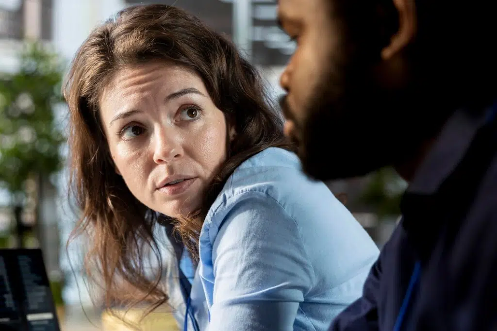 Woman in conversation with man
