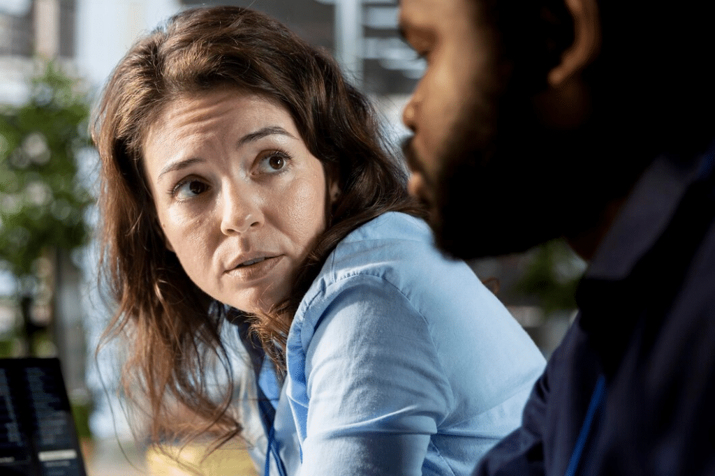 Woman in conversation with man