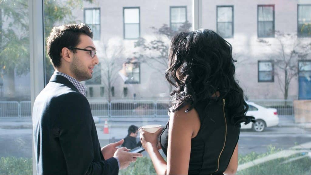 A man and woman talking in public