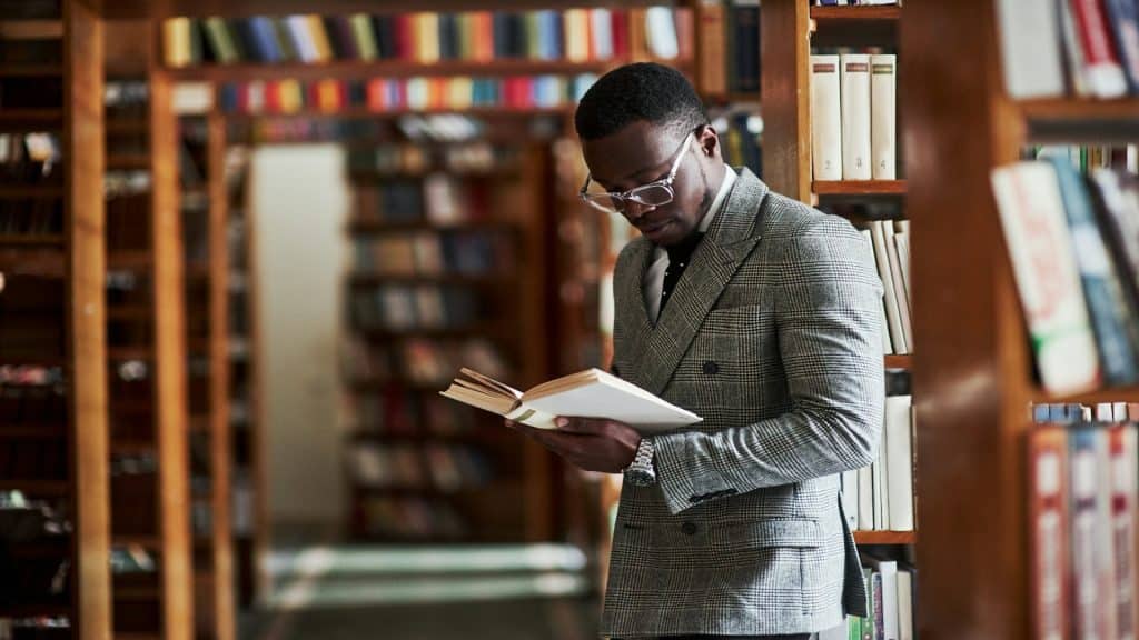 man reading and learning