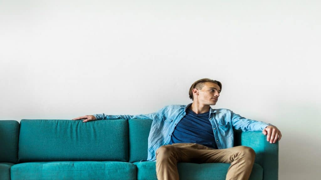 man sitting quietly during conversation