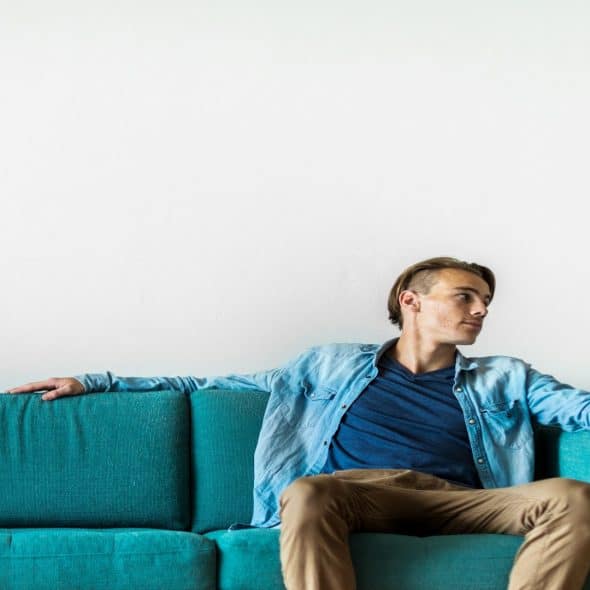 man sitting quietly during conversation