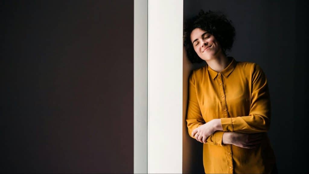 Woman alone and smiling