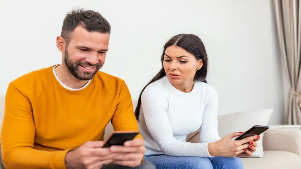 man checking phone then putting it away