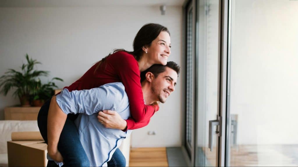 A mna carrying woman on his back