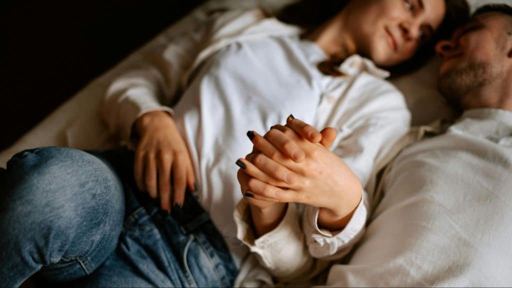 A man and woman holding hands