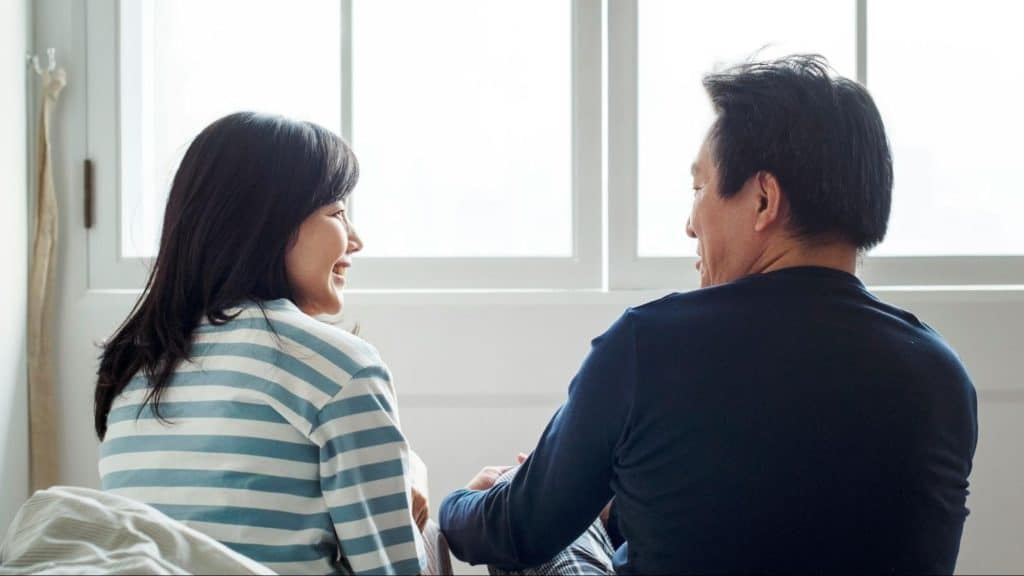 A man and woman talking