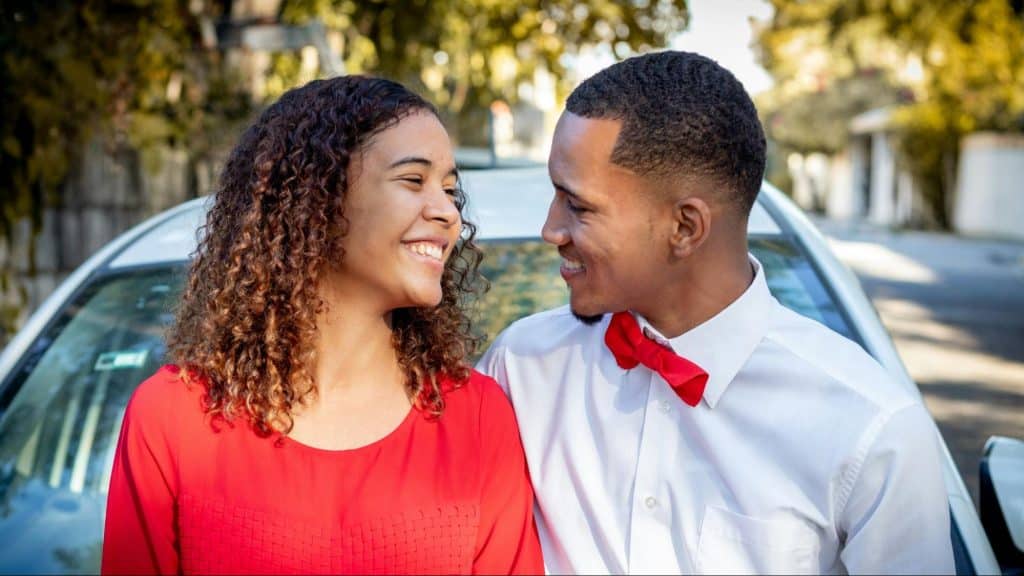 A man and woman smiling at each other