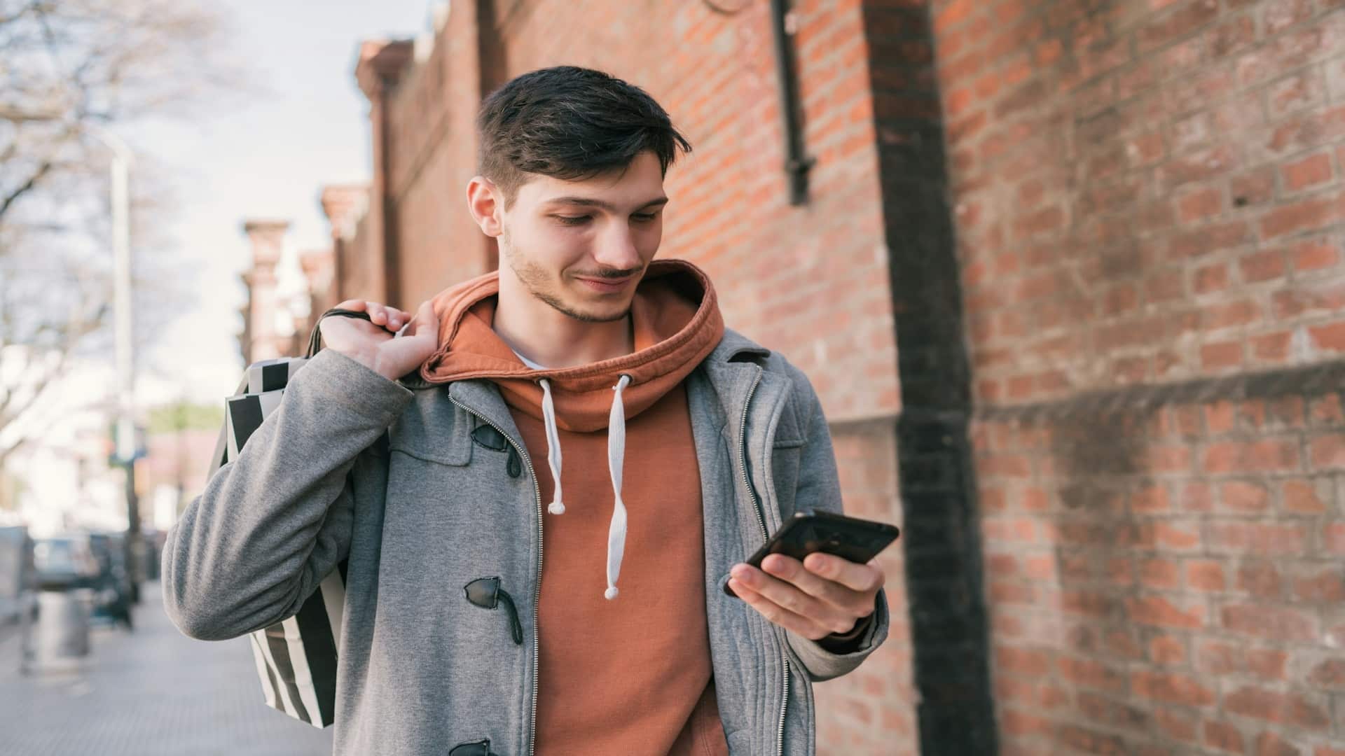 man using phone on dating app