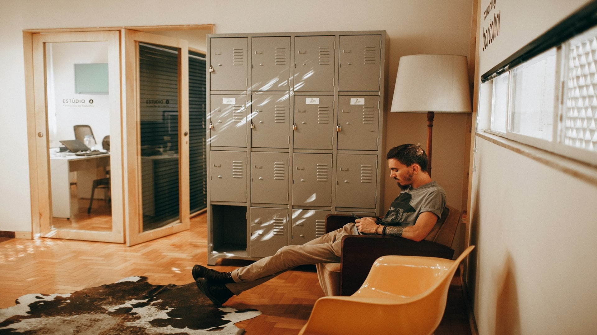 man sitting thoughtfully indoors