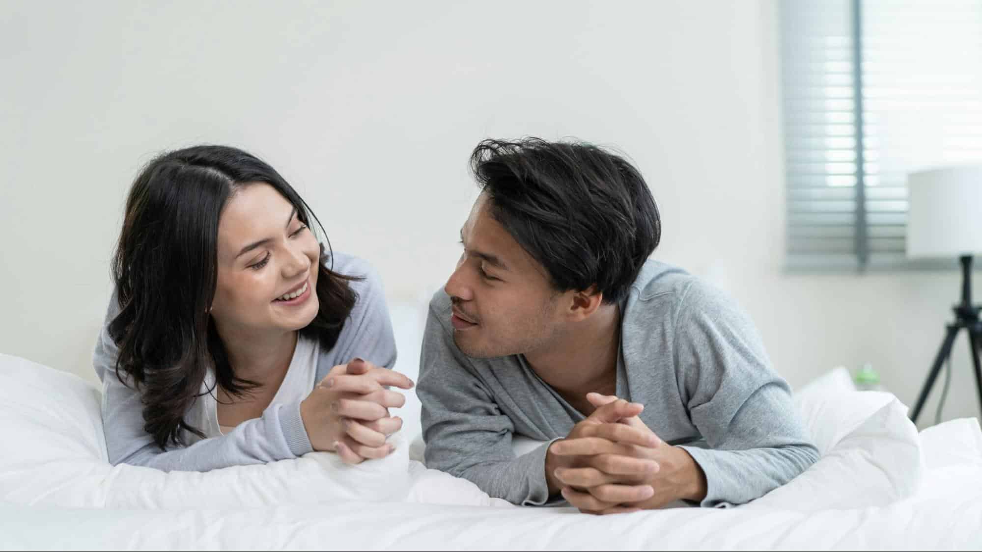 A man and woman smiling at each other