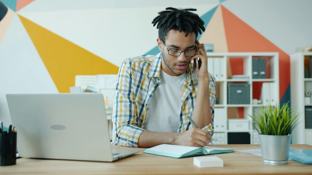 man reviewing bills at desk
