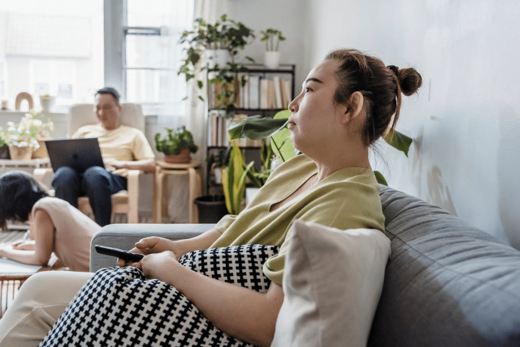 A Woman Sitting on a Couch Across from Man