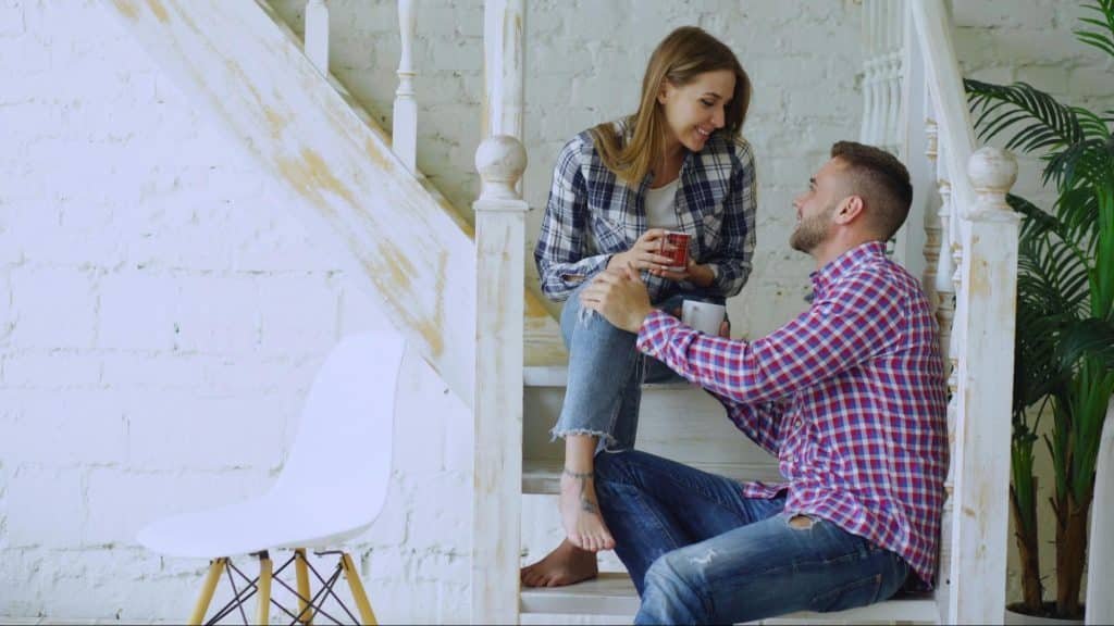 A man and woman at the staircase