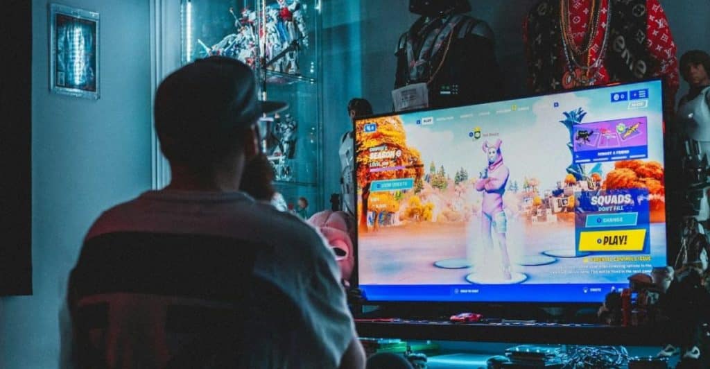 man watching television late