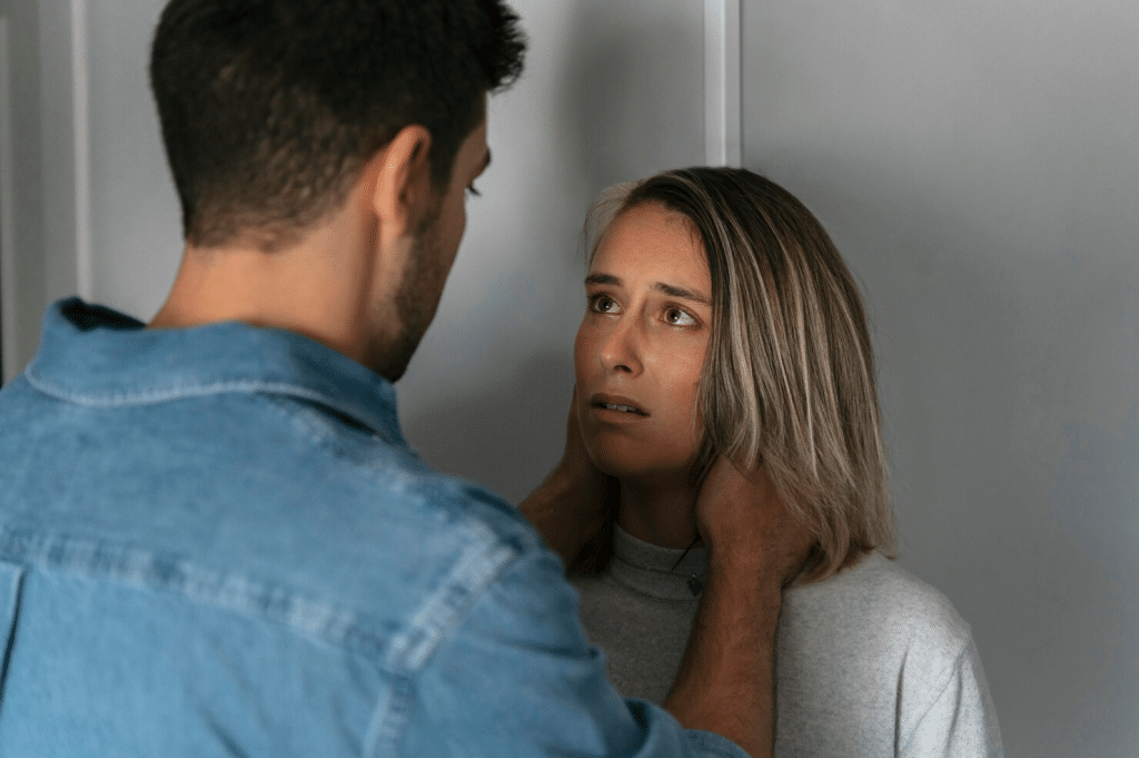 A man comforting a woman