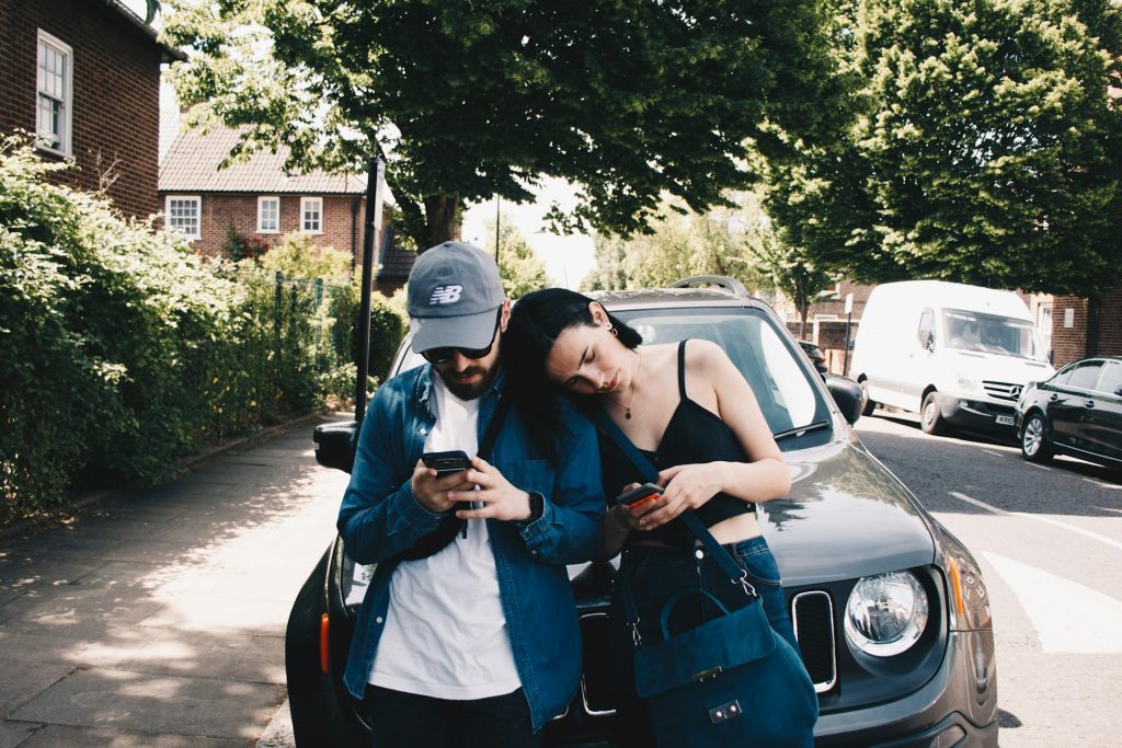 couple holding phones