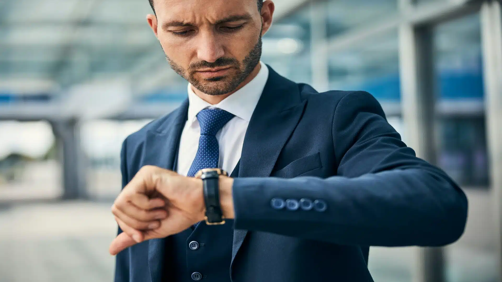 man checking watch late