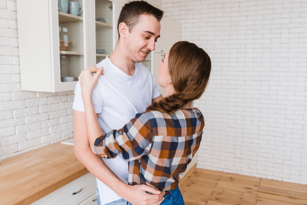 A man and woman facing each other