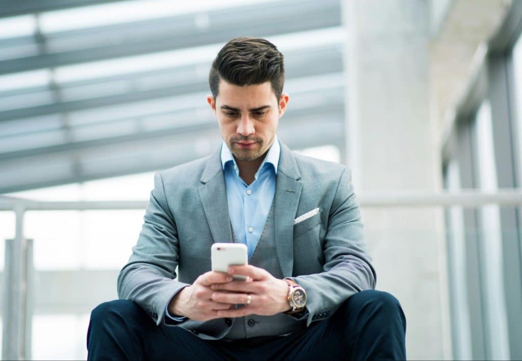A man staring at his phone