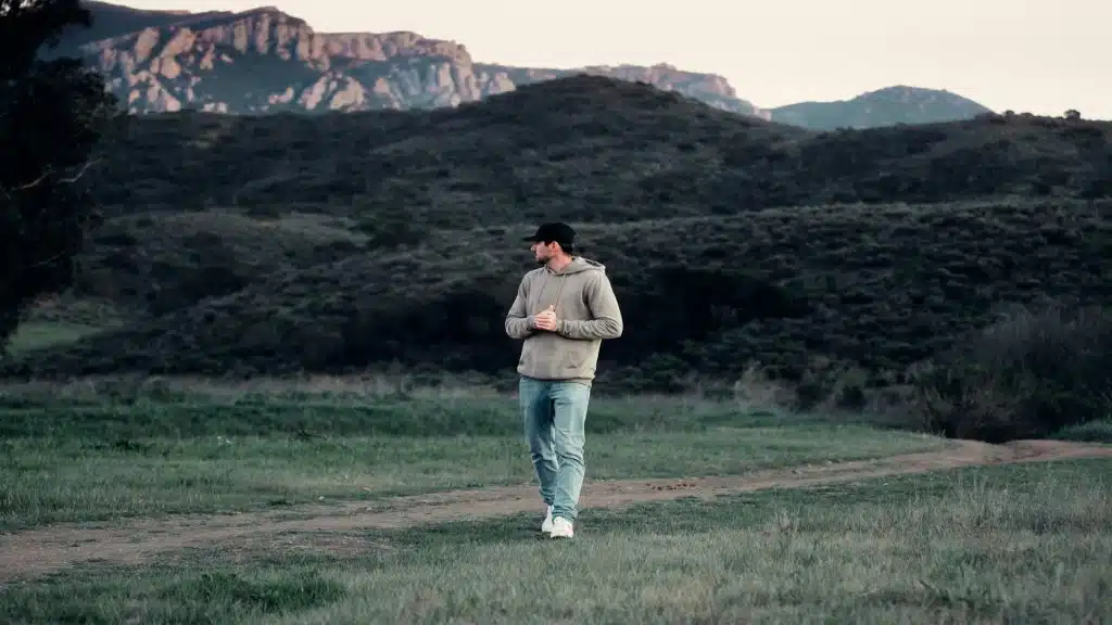 man walking calmly outdoors