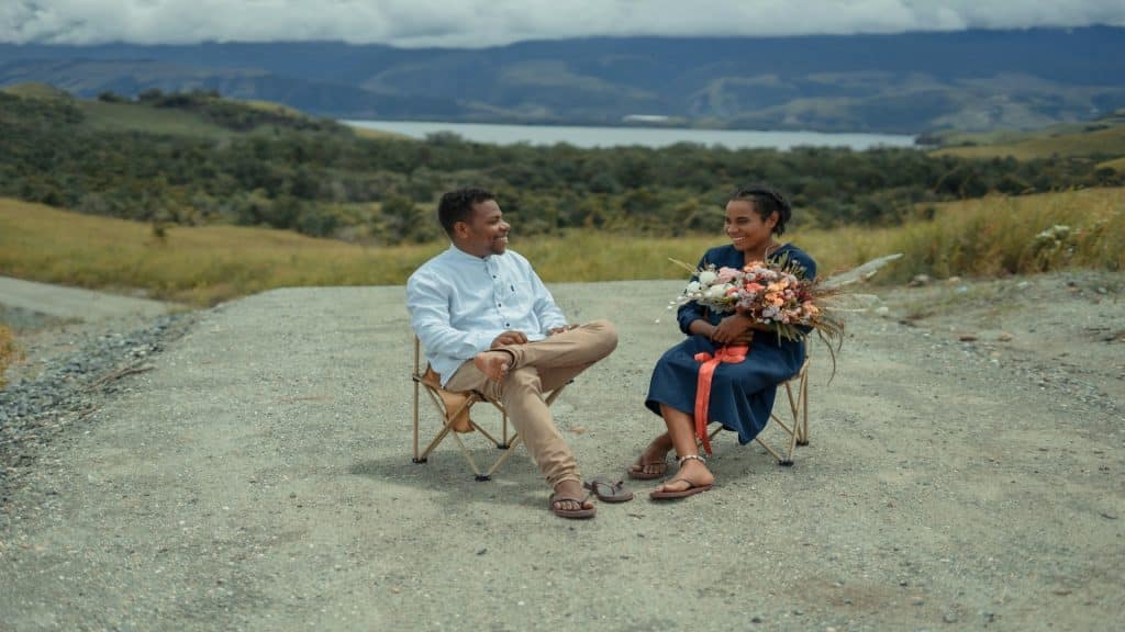 couple having a good moment then sitting apart