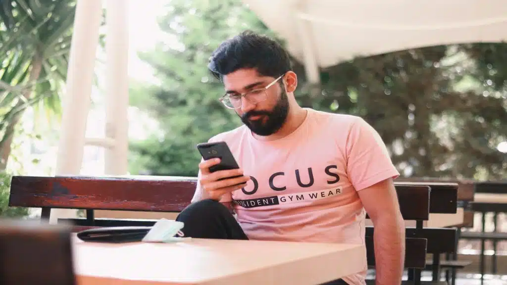 man texting frequently with focus