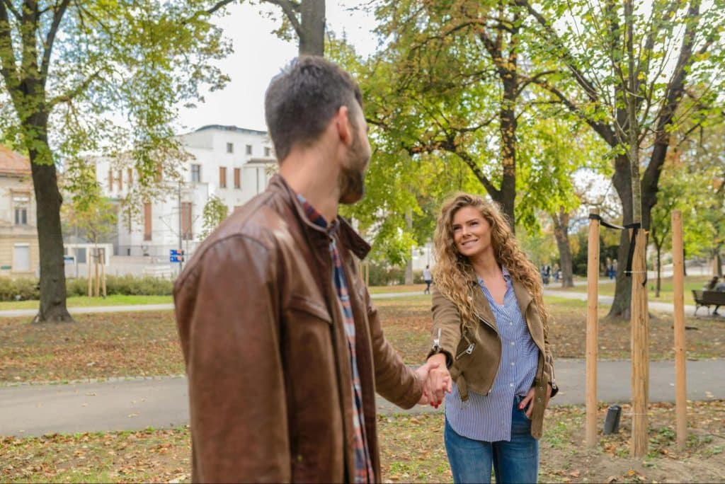 A man and woman holding hands