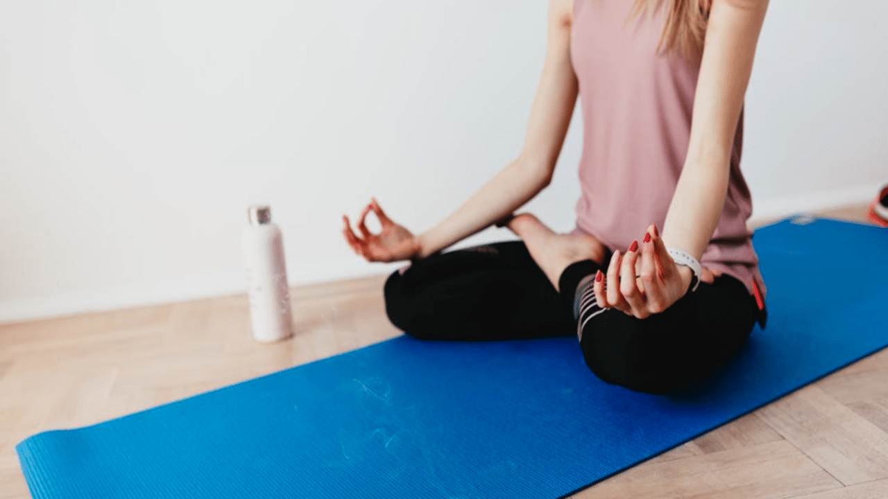 A woman doing yoga by herself