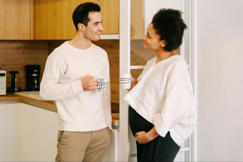 A man and woman having coffee together