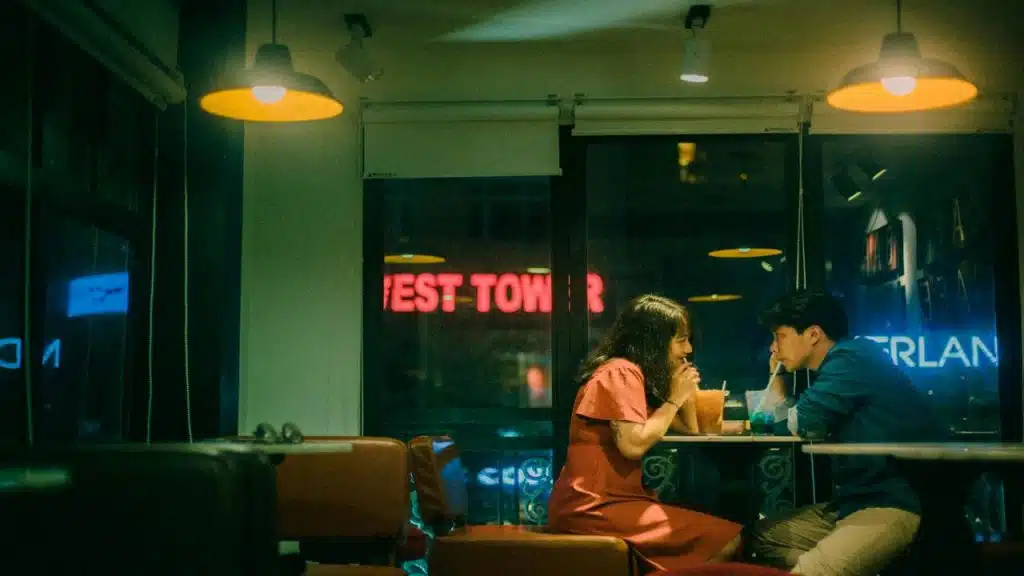 A couple on a cafe date at night