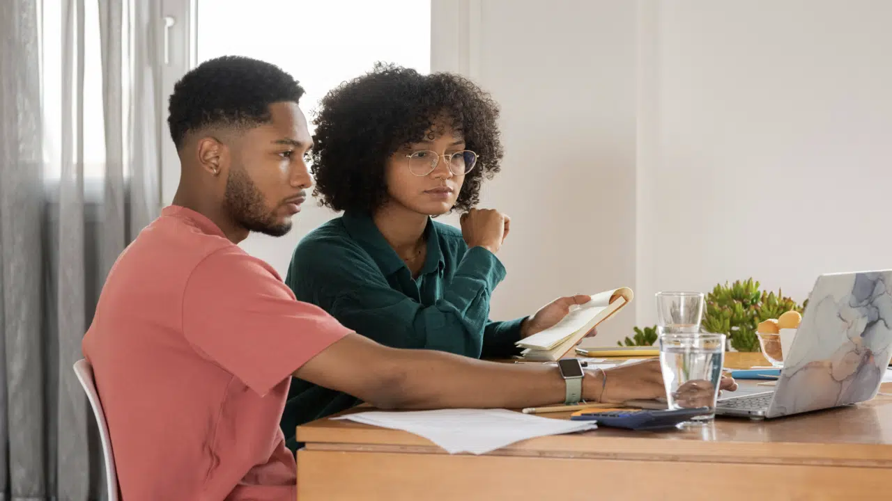 A couple looking at a laptop