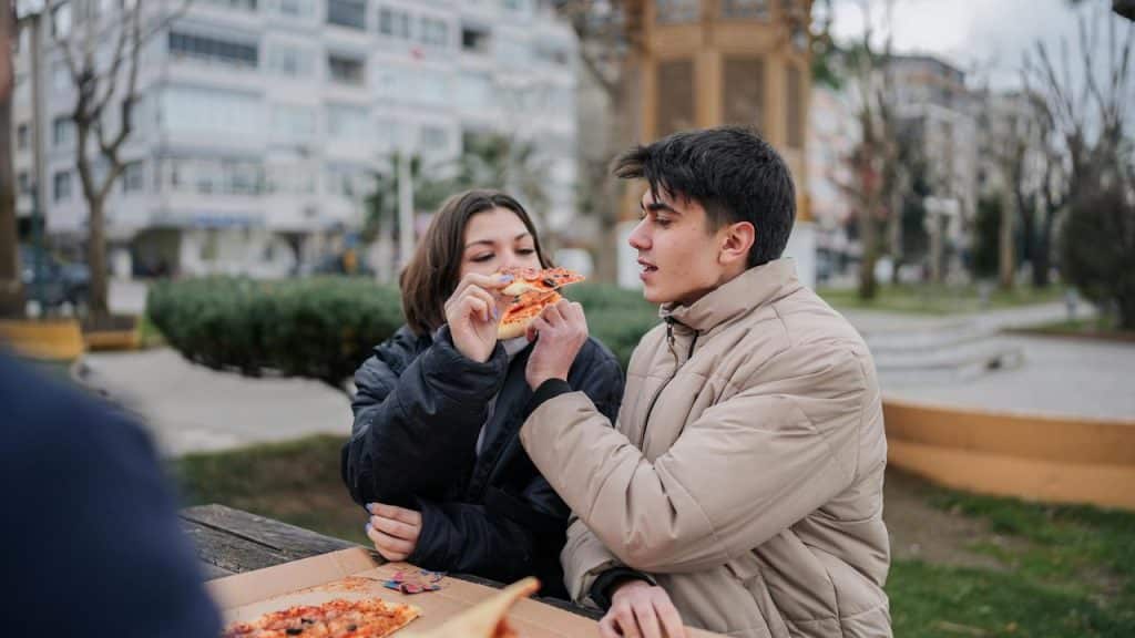 A couple sharing pizza