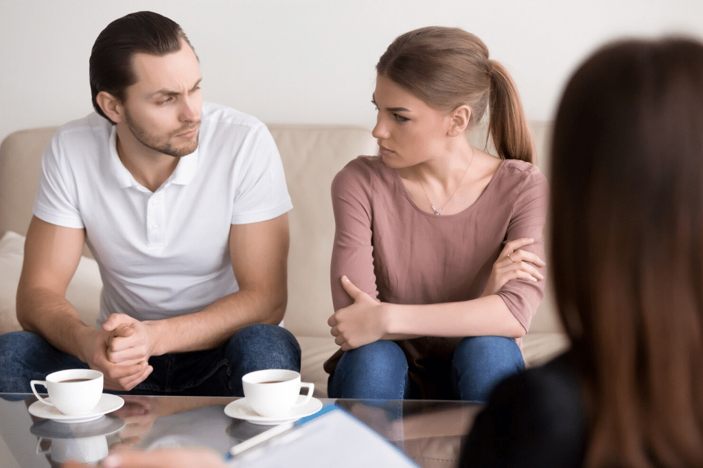 Woman looking at the couple having a problem 