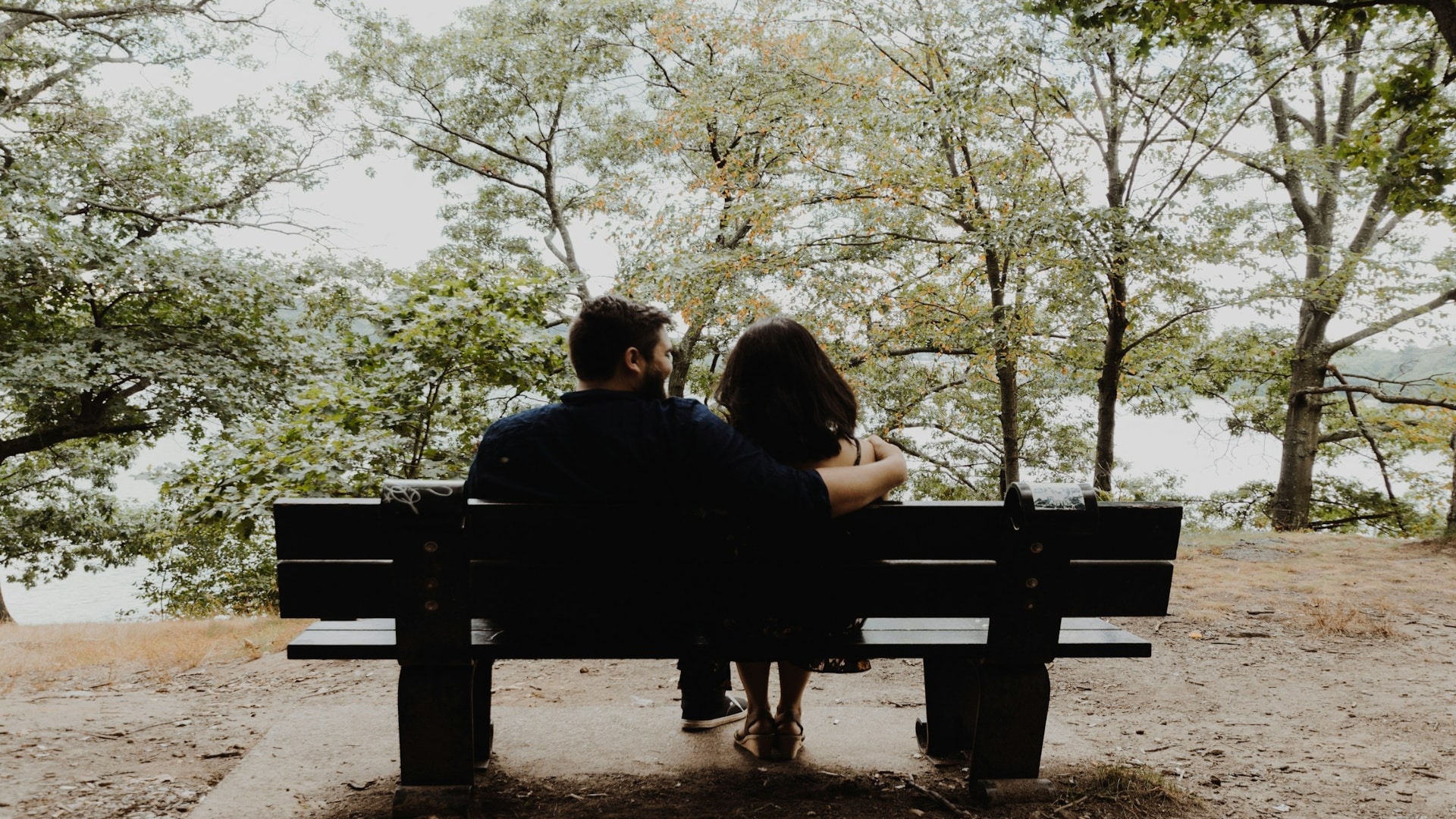 couple sitting close but distant