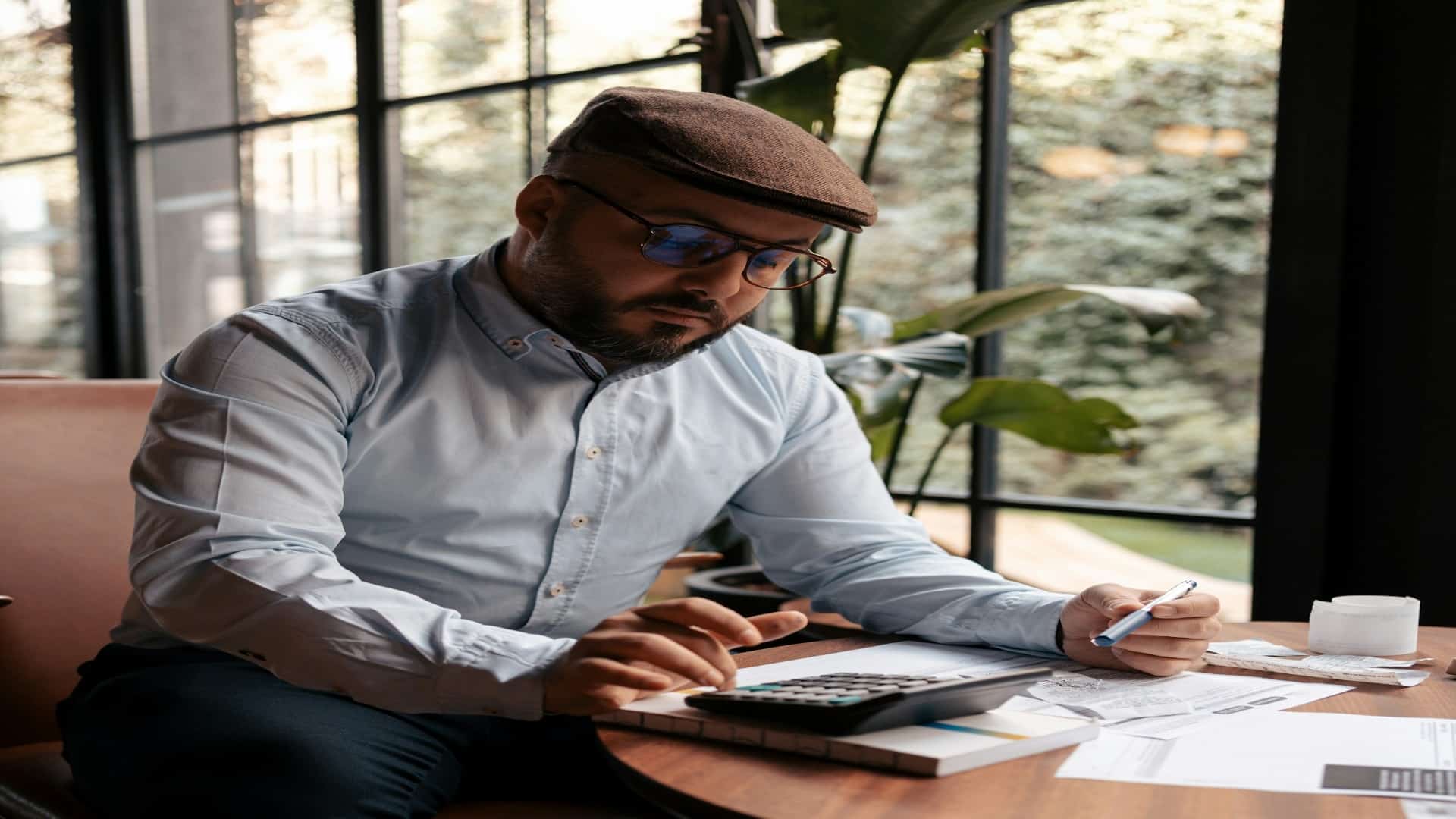 man reviewing financial goals notebook