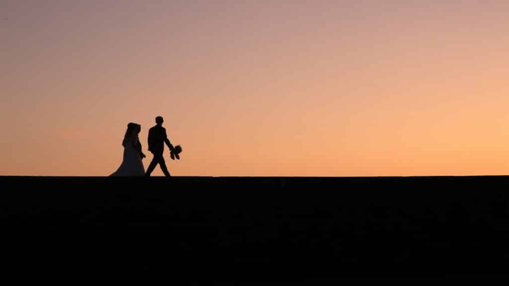 couple walking together at sunset
