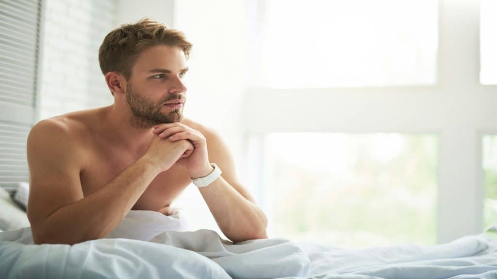 man thinking seriously indoors