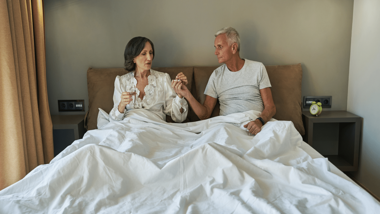A couple talking in bed