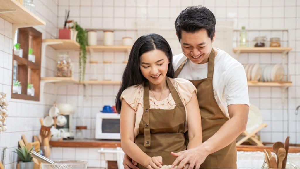 A man and woman at the kitchen