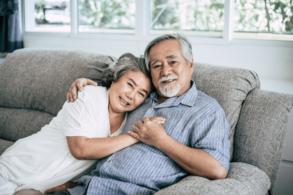 Senior couple playing together at living room