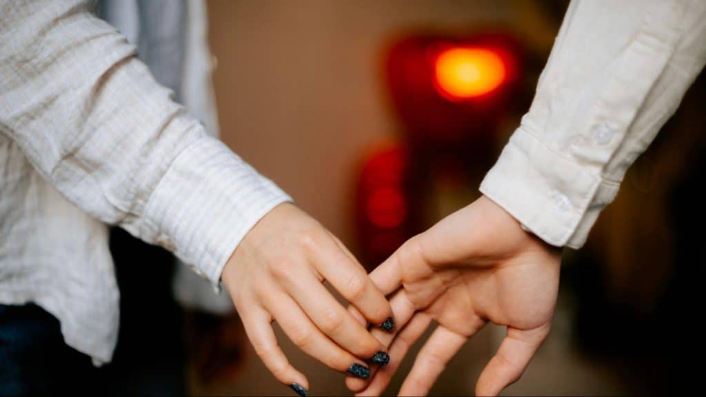 A man and woman holding hands