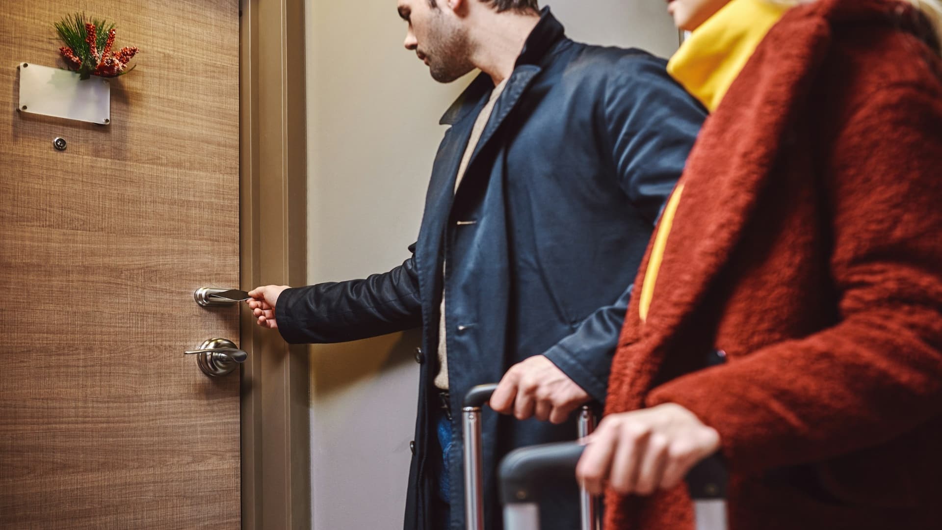 man opening door for partner