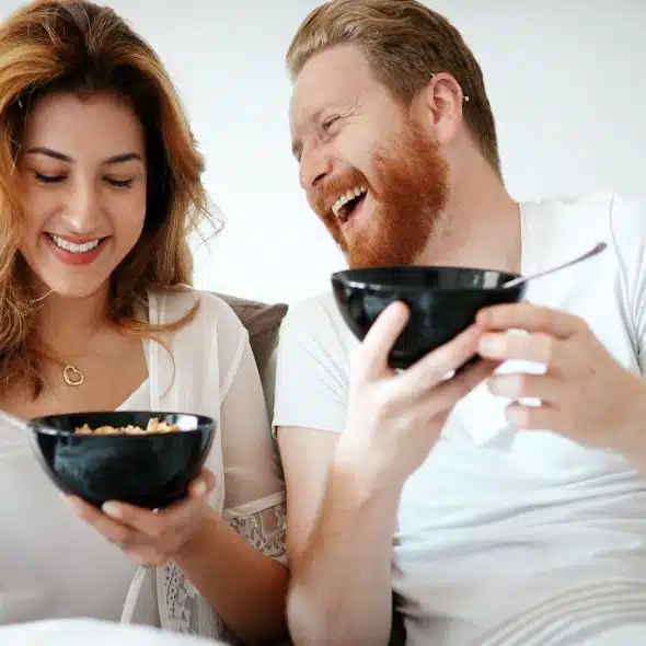 couple laughing together during conversation