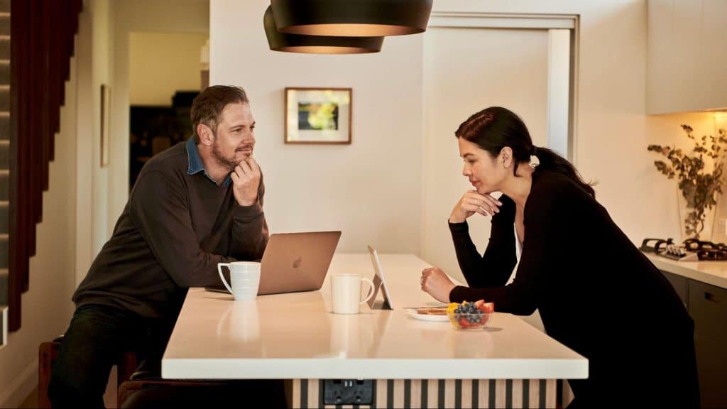 A man and woman talking about work