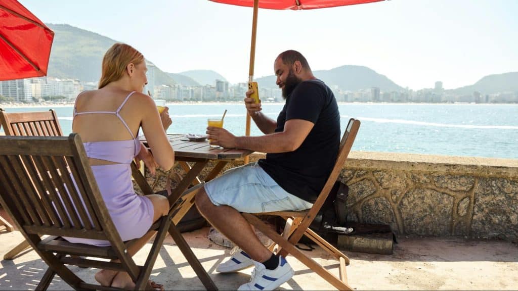 A man taking pictures of a women